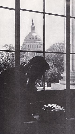 In sight of Capitol, private investigator Allen Crawford shows recording technique.